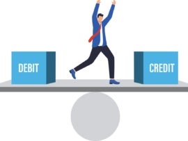 Businessman keeping balance between debit and credit.