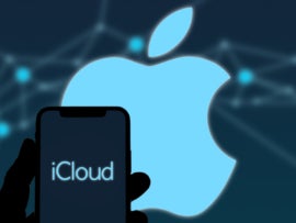 Smartphone and iCloud Logo with Apple logo in the background.