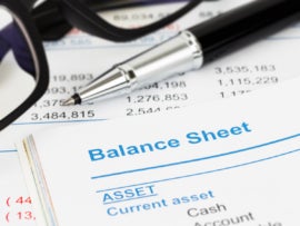 Balance sheet in stockholder report book, balance sheet is mock-up.